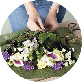 Woman removing packaging from flowers
