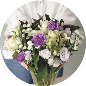 Woman with an arranged bouquet in vase