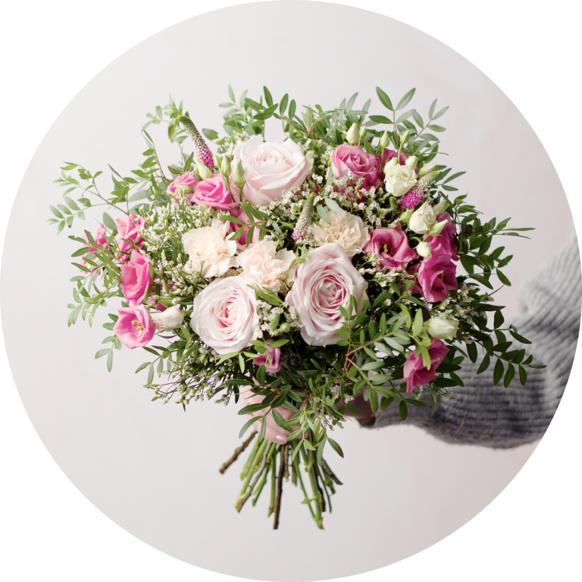 Bouquet with fresh pink flowers including carnations and roses