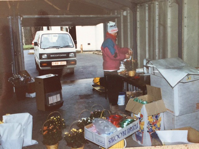 A photo of Sandra arranging flowers in Mansfield shopping centre